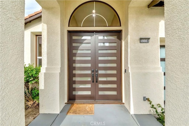 5338 S Chariton Ave, Ladera Heights, CA 90056 - view of exterior entry with french doors and stucco siding