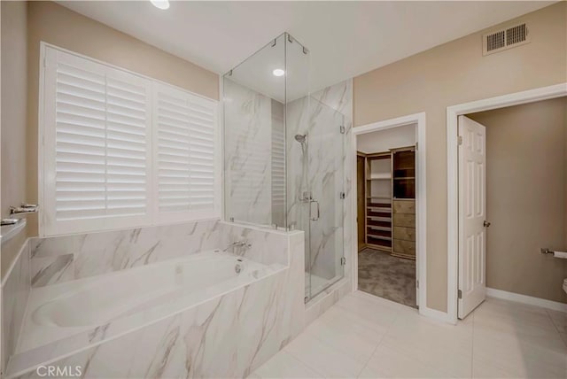 5338 S Chariton Ave, Ladera Heights, CA 90056 - full bath with a marble finish shower, a garden tub, tile patterned floors, and a walk in closet