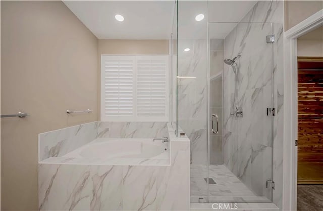 5338 S Chariton Ave, Ladera Heights, CA 90056 - full bath featuring a garden tub, a marble finish shower, and recessed lighting