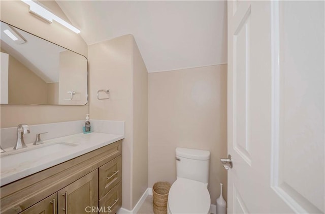 5338 S Chariton Ave, Ladera Heights, CA 90056 - bathroom with vanity, toilet, lofted ceiling, and baseboards
