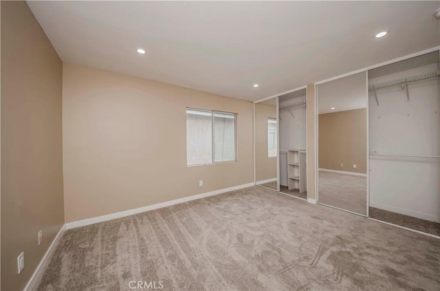 5338 S Chariton Ave, Ladera Heights, CA 90056 - unfurnished bedroom featuring multiple closets, carpet floors, baseboards, and recessed lighting