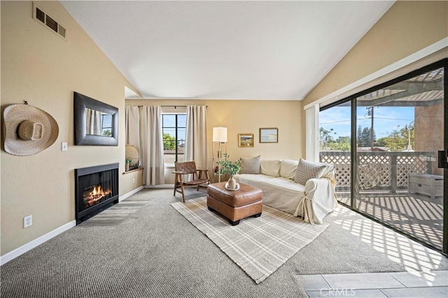 3501 W Greentree Cir Unit F, Anaheim, CA 92804 - carpeted living room featuring vaulted ceiling, a fireplace with flush hearth, and baseboards