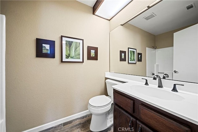 3501 W Greentree Cir Unit F, Anaheim, CA 92804 - bathroom featuring toilet, baseboards, vanity, and wood finished floors