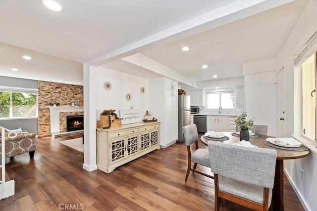 770 Libby Dr, Riverside, CA 92507 - dining space featuring plenty of natural light, recessed lighting, wood finished floors, and a fireplace