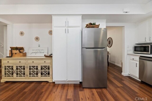 770 Libby Dr, Riverside, CA 92507 - kitchen featuring stainless steel appliances, dark wood finished floors, and white cabinetry