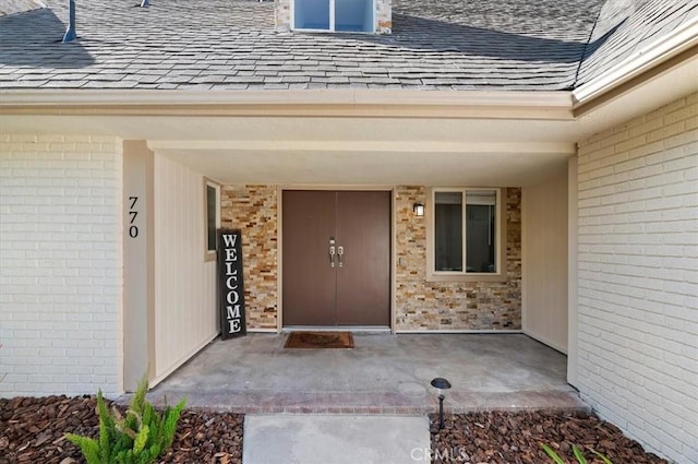 770 Libby Dr, Riverside, CA 92507 - entrance to property featuring roof with shingles and brick siding