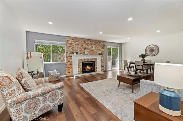 770 Libby Dr, Riverside, CA 92507 - living room featuring healthy amount of natural light, wood finished floors, recessed lighting, and a large fireplace