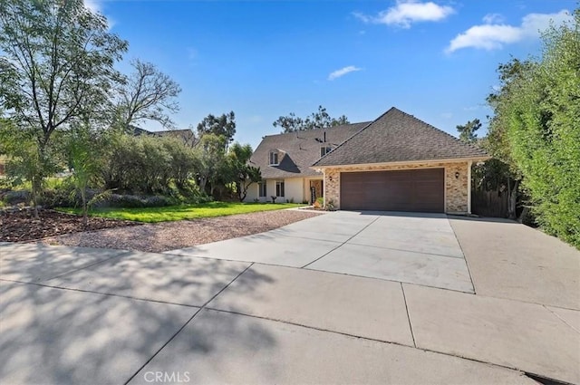 770 Libby Dr, Riverside, CA 92507 - view of front of house featuring driveway, an attached garage, brick siding, and roof with shingles