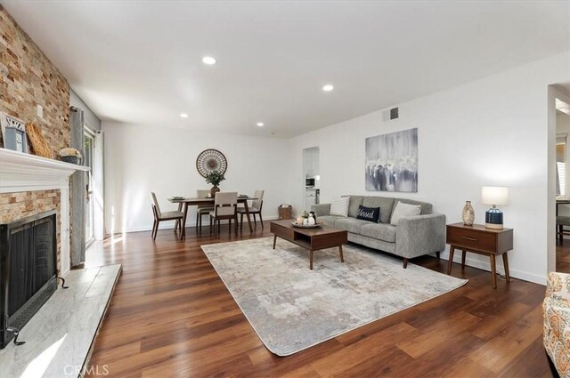 770 Libby Dr, Riverside, CA 92507 - living area with wood finished floors, recessed lighting, a fireplace, and baseboards