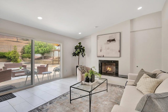 4103 Corral Canyon Rd, Bonita, CA 91902 - living area featuring a high end fireplace, vaulted ceiling, recessed lighting, and light tile patterned floors
