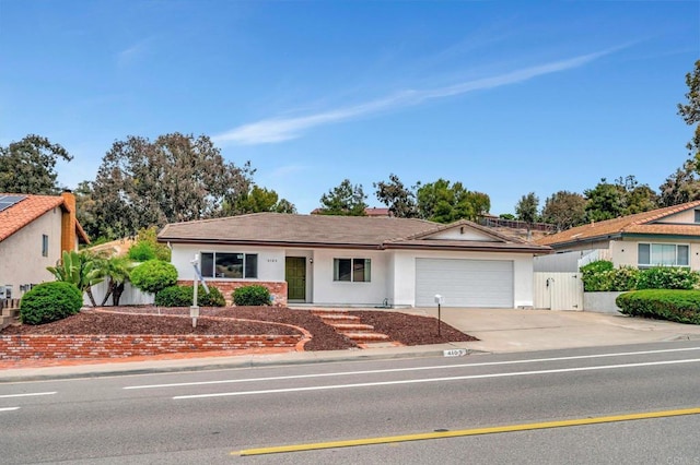 4103 Corral Canyon Rd, Bonita, CA 91902 - ranch-style house with a garage, driveway, stucco siding, and a gate