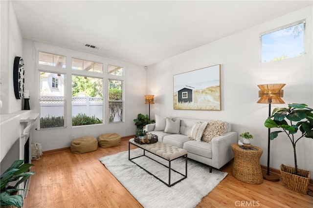 167 Iris Ln, Brea, CA 92821 - living room featuring wood finished floors, baseboards, and a fireplace