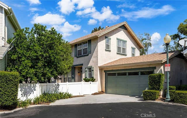 167 Iris Ln, Brea, CA 92821 - view of front facade with asphalt driveway, stucco siding, and a garage