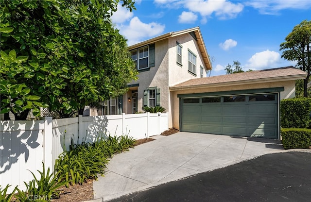 167 Iris Ln, Brea, CA 92821 - traditional home with stucco siding, concrete driveway, and an attached garage