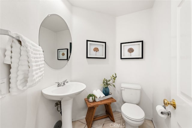 167 Iris Ln, Brea, CA 92821 - half bath featuring toilet, tile patterned flooring, and baseboards