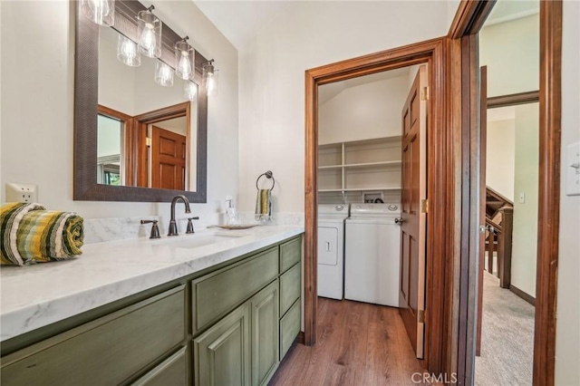 551 Raccoon Ct, Lake Arrowhead, CA 92352 - bathroom with washing machine and clothes dryer, vanity, and wood finished floors