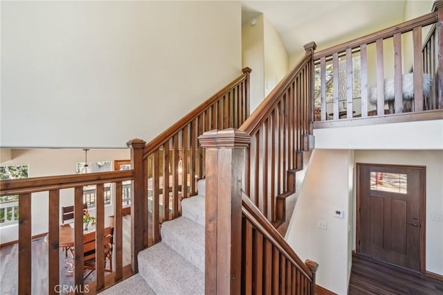 551 Raccoon Ct, Lake Arrowhead, CA 92352 - stairs with a high ceiling and wood finished floors