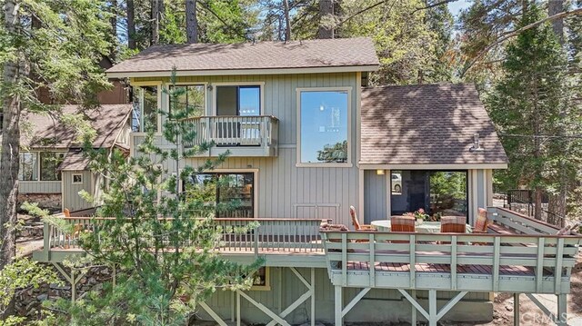 551 Raccoon Ct, Lake Arrowhead, CA 92352 - rear view of property with a shingled roof, a balcony, and a deck