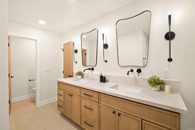 417 Santa Victoria, Solana Beach, CA 92075 - full bathroom with double vanity, toilet, tile patterned flooring, recessed lighting, and baseboards