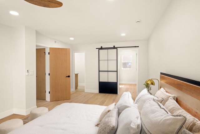 417 Santa Victoria, Solana Beach, CA 92075 - bedroom with a barn door, light wood finished floors, recessed lighting, and baseboards