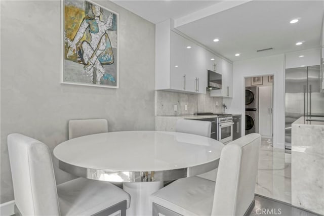 14347 Albers St Unit 207, Sherman Oaks, CA 91401 - dining area with stacked washing machine and dryer and recessed lighting