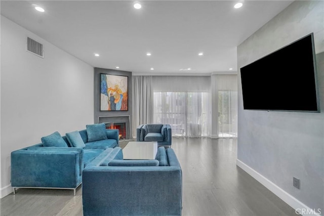 14347 Albers St Unit 207, Sherman Oaks, CA 91401 - living room with baseboards, wood finished floors, recessed lighting, and a warm lit fireplace