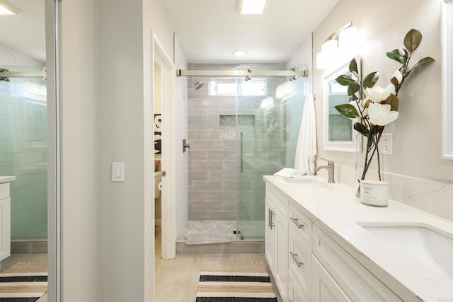 13356 Corte De Chucena, San Diego, CA 92128 - full bath with double vanity, a stall shower, and tile patterned flooring
