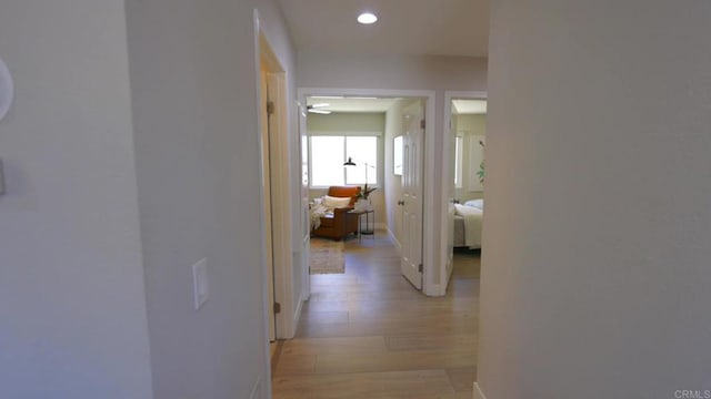 13356 Corte De Chucena, San Diego, CA 92128 - hall with light wood-style flooring, baseboards, and recessed lighting