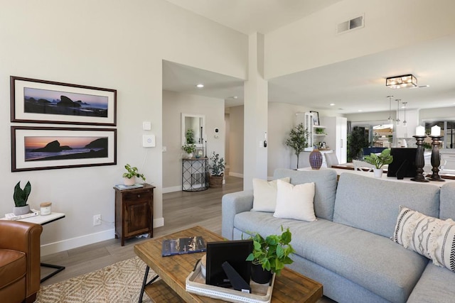 13356 Corte De Chucena, San Diego, CA 92128 - living area with light wood-style flooring, baseboards, and recessed lighting
