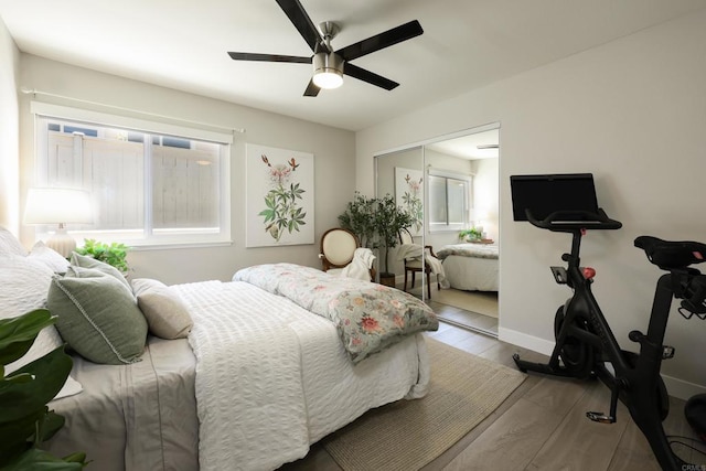 13356 Corte De Chucena, San Diego, CA 92128 - bedroom featuring ceiling fan, wood finished floors, a closet, and baseboards