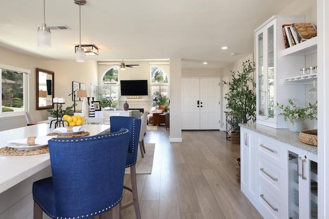 13356 Corte De Chucena, San Diego, CA 92128 - dining space featuring a ceiling fan, wood finished floors, and recessed lighting