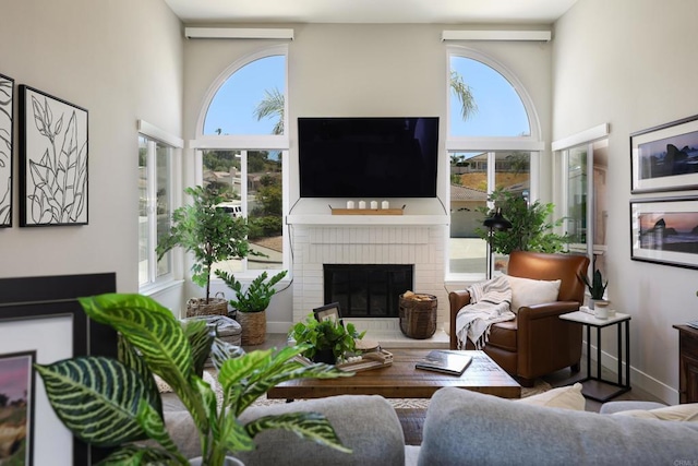13356 Corte De Chucena, San Diego, CA 92128 - living area featuring a fireplace and a high ceiling