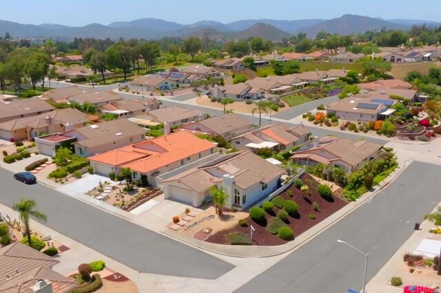 13356 Corte De Chucena, San Diego, CA 92128 - aerial perspective of suburban area with a mountainous background