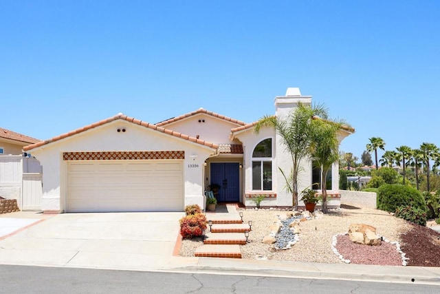 13356 Corte De Chucena, San Diego, CA 92128 - mediterranean / spanish house featuring stucco siding, driveway, a garage, and a tiled roof
