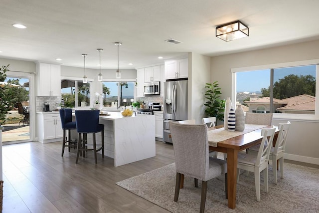 13356 Corte De Chucena, San Diego, CA 92128 - dining room with recessed lighting and light wood-style flooring