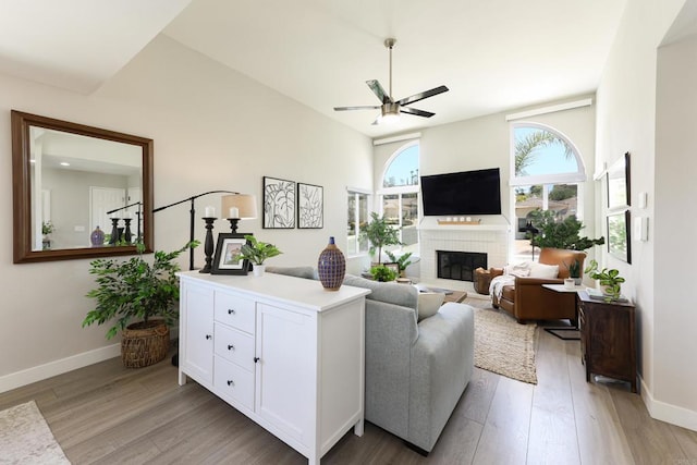 13356 Corte De Chucena, San Diego, CA 92128 - living room featuring ceiling fan, light wood-style floors, and a brick fireplace