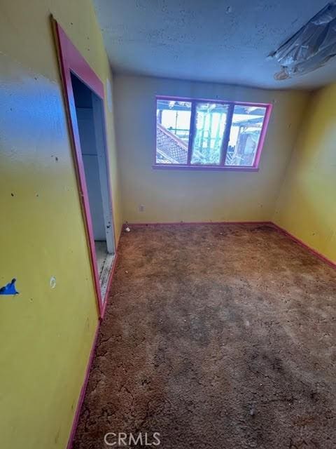 84673 9th St, Trona, CA 93562 - unfurnished bedroom featuring carpet and a closet