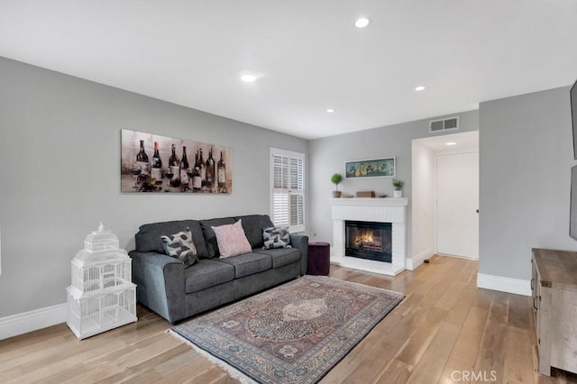 167 Camino Leon, Camarillo, CA 93012 - living room featuring wood finished floors, baseboards, a brick fireplace, and recessed lighting