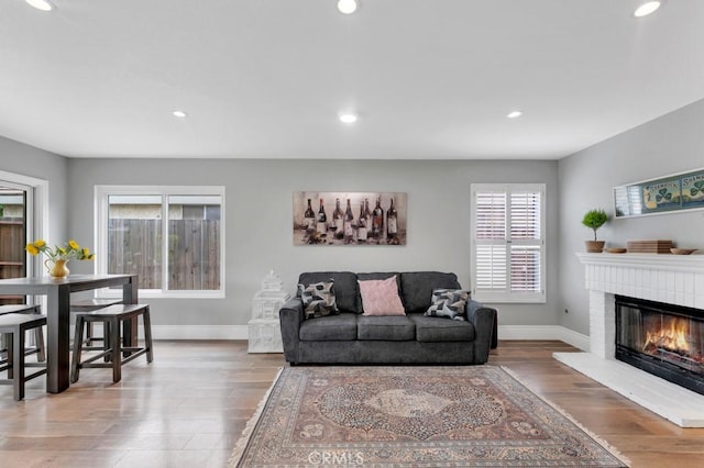 167 Camino Leon, Camarillo, CA 93012 - living area with baseboards, recessed lighting, wood finished floors, and a brick fireplace