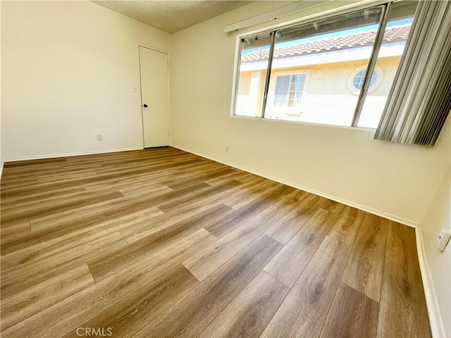 220 N Alhambra Ave Unit B, Monterey Park, CA 91755 - spare room with wood finished floors and baseboards