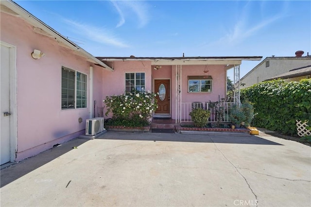14276 Aztec St, Sylmar, CA 91342 - property entrance with stucco siding and ac unit
