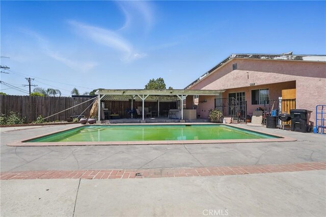 14276 Aztec St, Sylmar, CA 91342 - view of swimming pool featuring a patio area