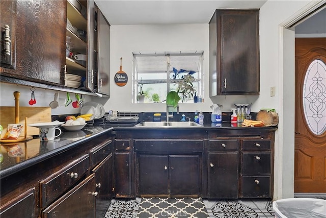 14276 Aztec St, Sylmar, CA 91342 - kitchen featuring a sink, dark countertops, and dark brown cabinets