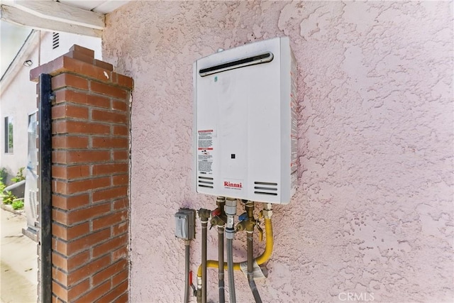 14276 Aztec St, Sylmar, CA 91342 - exterior view of stucco siding and tankless water heater