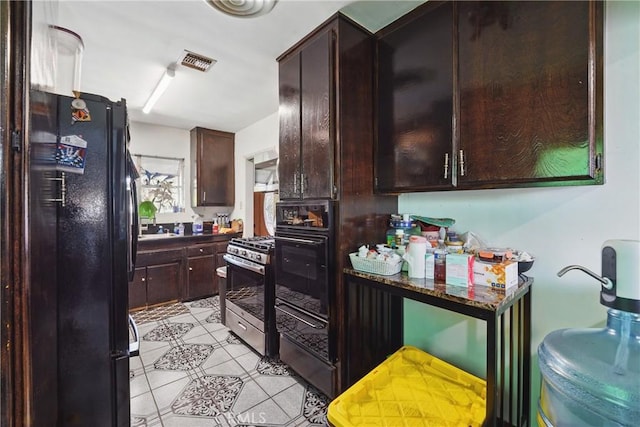 14276 Aztec St, Sylmar, CA 91342 - kitchen featuring black appliances, light tile patterned flooring, dark brown cabinets, and dark countertops