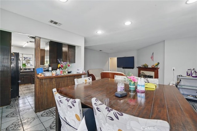 14276 Aztec St, Sylmar, CA 91342 - dining area with recessed lighting and light tile patterned floors