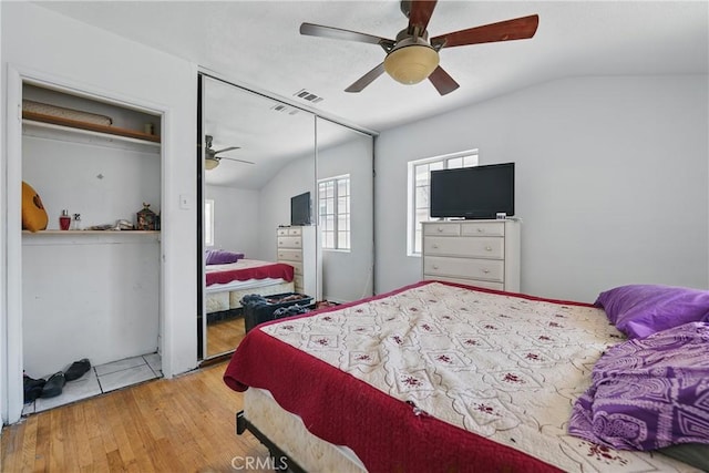 14276 Aztec St, Sylmar, CA 91342 - bedroom featuring vaulted ceiling, wood-type flooring, a closet, and a ceiling fan