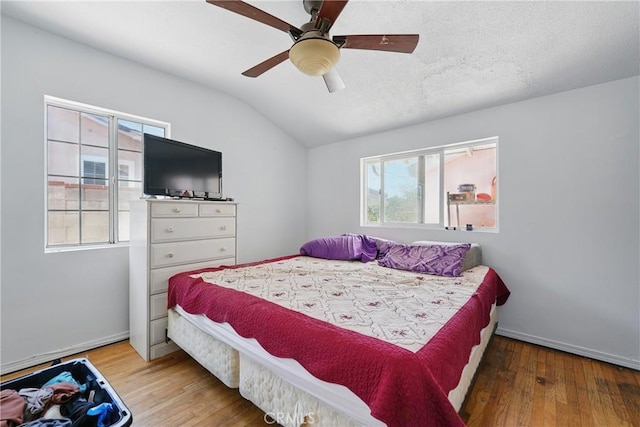14276 Aztec St, Sylmar, CA 91342 - bedroom with lofted ceiling, wood finished floors, baseboards, and ceiling fan
