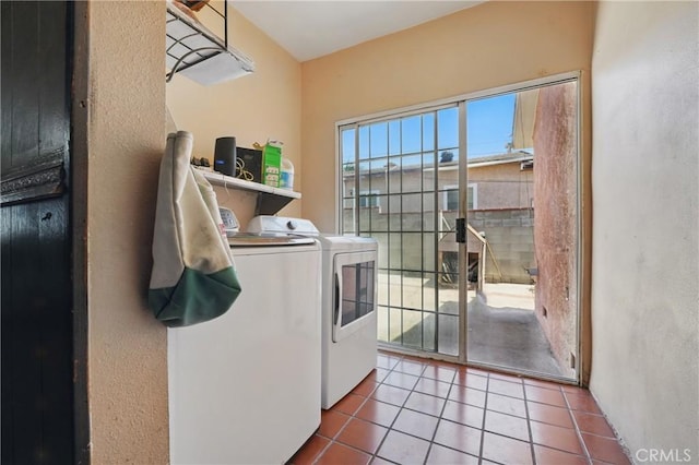 14276 Aztec St, Sylmar, CA 91342 - laundry room featuring washing machine and clothes dryer, tile patterned flooring, and a textured wall