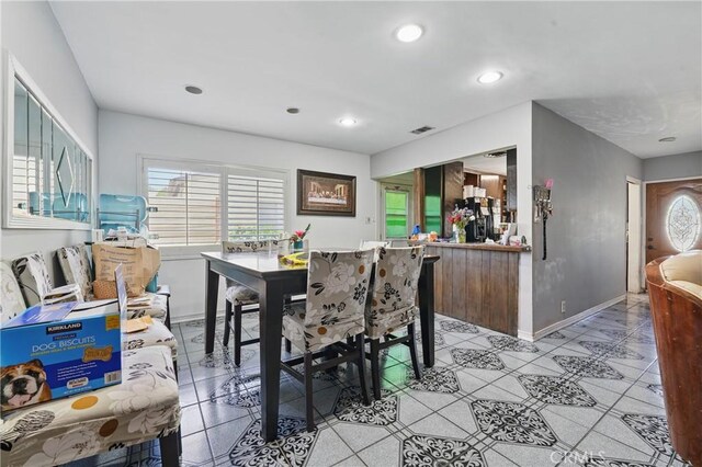 14276 Aztec St, Sylmar, CA 91342 - dining room with healthy amount of natural light, baseboards, recessed lighting, and light tile patterned floors